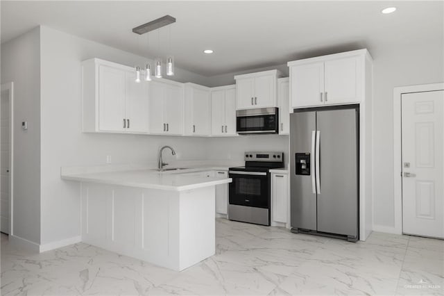 kitchen with sink, kitchen peninsula, decorative light fixtures, white cabinetry, and stainless steel appliances