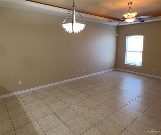 tiled spare room with ceiling fan