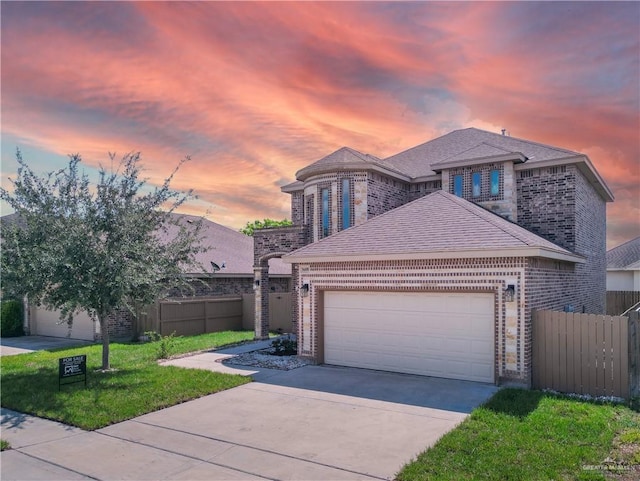 view of front of house with a lawn and a garage