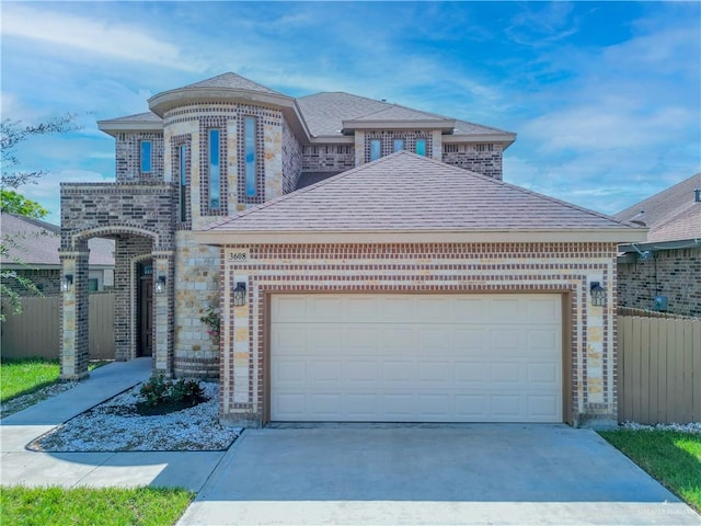 3608 Morris St, Edinburg, TX 78542 - french country style house with driveway, brick siding, a shingled roof, and a garage