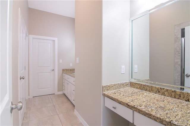 bathroom with tile patterned floors and vanity