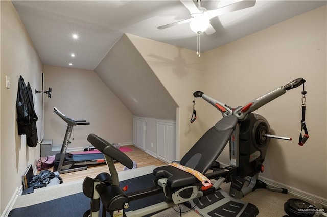 exercise room featuring light hardwood / wood-style floors, ceiling fan, and lofted ceiling