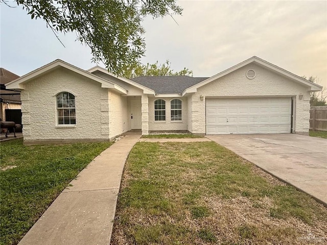 single story home with driveway, fence, a front yard, and a garage