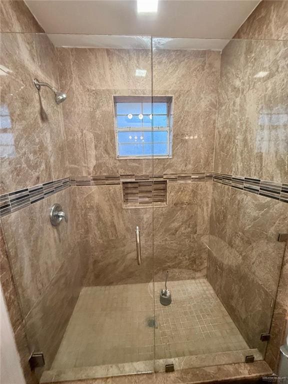 bathroom with a shower stall