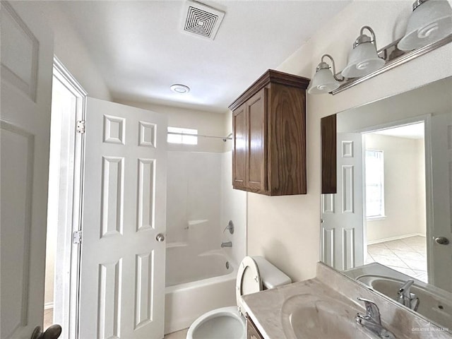 full bathroom featuring vanity, toilet, and  shower combination