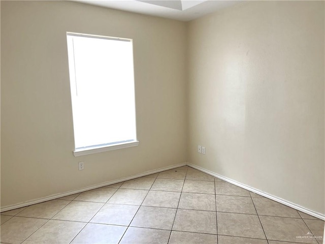 spare room with light tile patterned floors