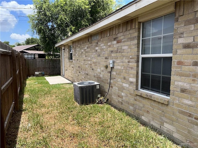 view of yard featuring central air condition unit