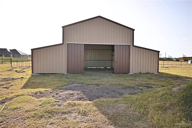 view of outbuilding featuring a yard