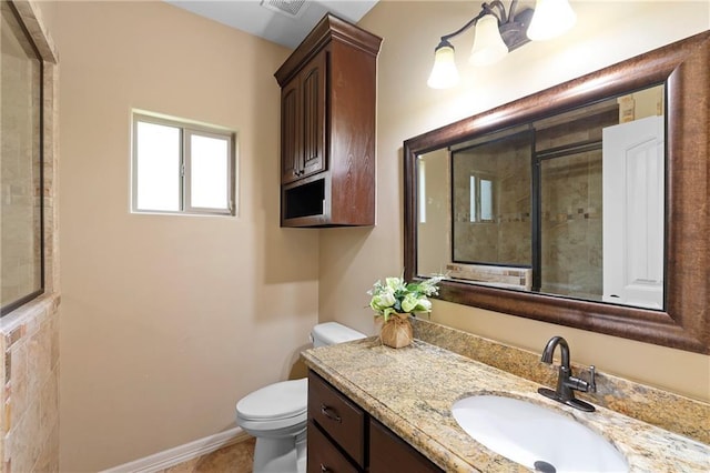 bathroom with toilet, baseboards, and vanity