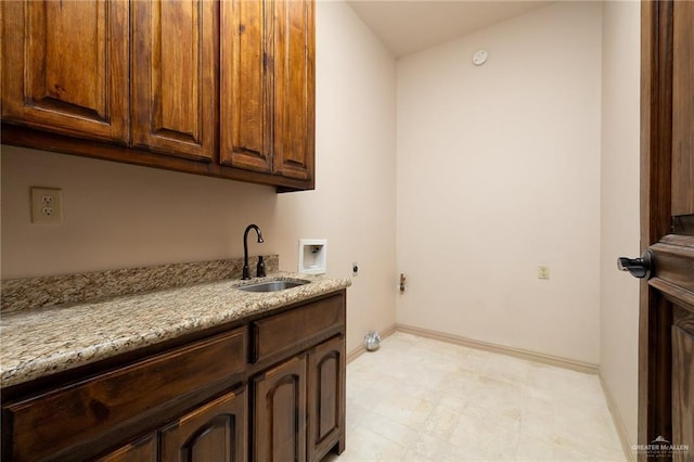 laundry area with cabinets, sink, hookup for a washing machine, and electric dryer hookup