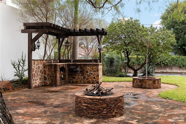 view of patio featuring an outdoor fire pit