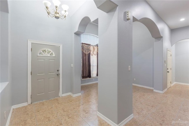 entryway featuring a chandelier