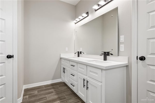 bathroom featuring vanity and wood-type flooring