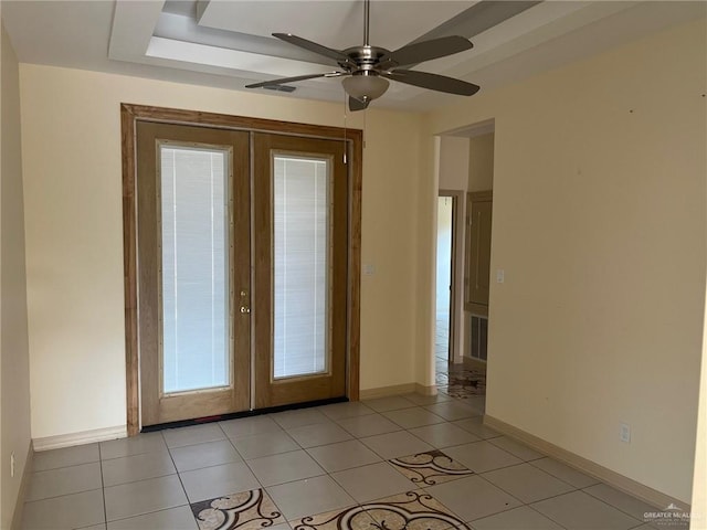 entryway with french doors, ceiling fan, and light tile patterned flooring