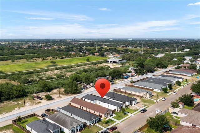 aerial perspective of suburban area featuring a tree filled landscape