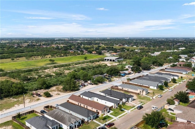 aerial perspective of suburban area with a tree filled landscape