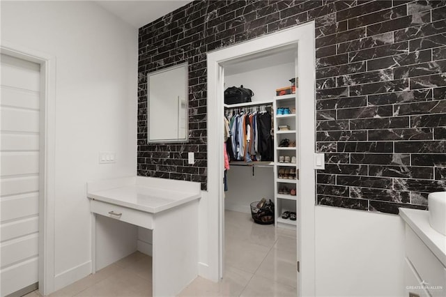 walk in closet featuring light tile patterned floors