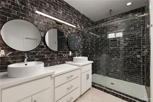 bathroom featuring double vanity, a shower stall, decorative backsplash, tile walls, and recessed lighting