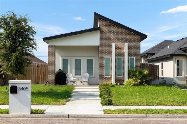 view of front of home featuring brick siding