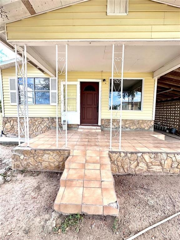 entrance to property with a porch