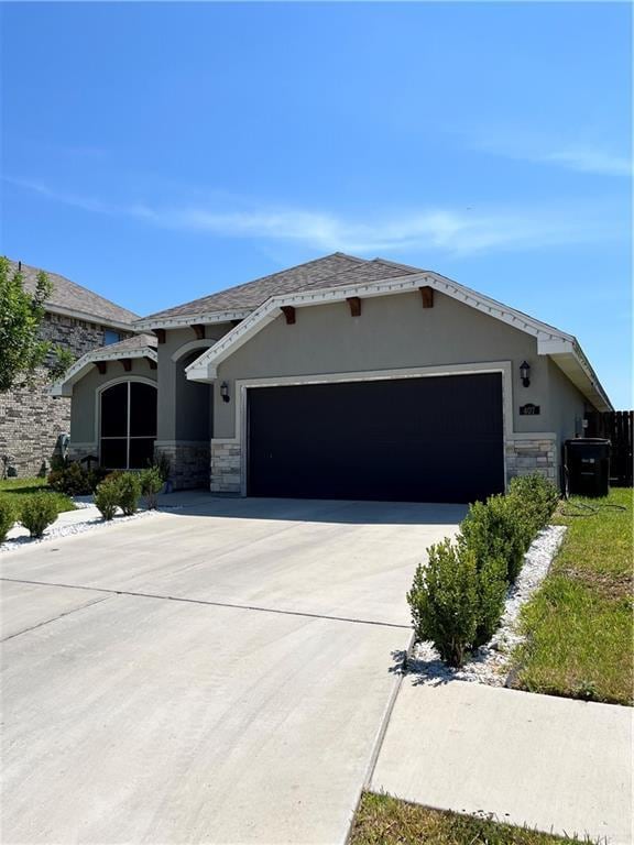 ranch-style house featuring a garage