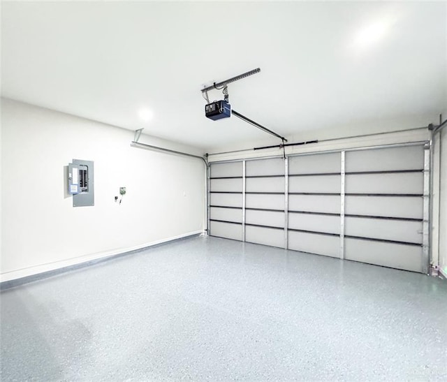 garage with a garage door opener and electric panel