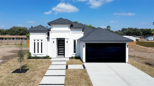 view of front facade featuring a garage and a front yard