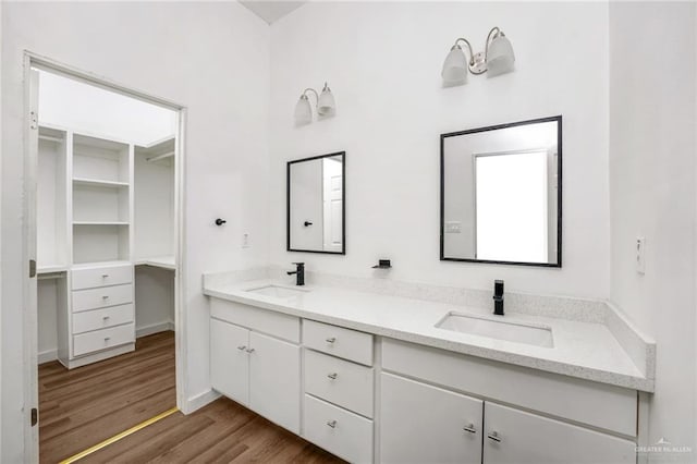 3609 E Santorini Dr, Edinburg, TX 78542 - full bathroom featuring a sink, double vanity, and wood finished floors