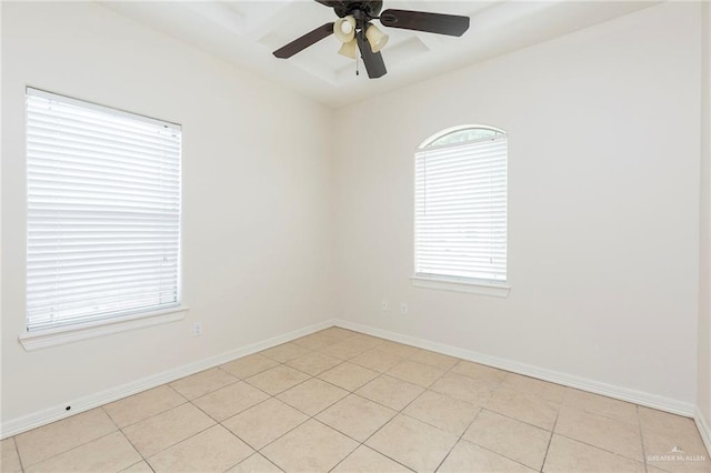 tiled empty room with ceiling fan