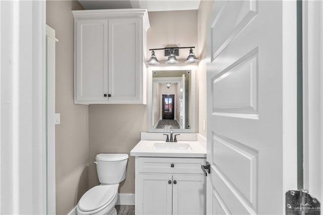 bathroom with vanity and toilet