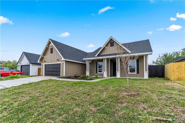 view of front of house featuring a garage and a front lawn