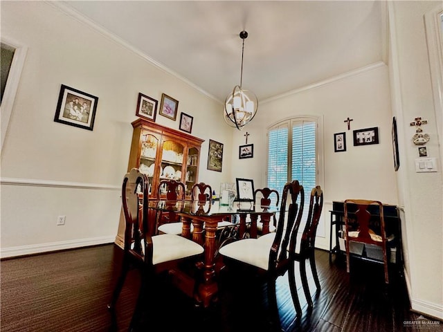 dining room with crown molding, baseboards, and dark wood finished floors