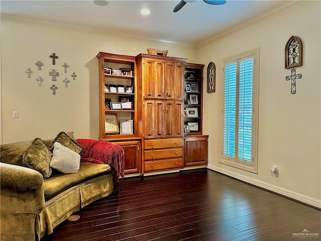 living area featuring crown molding, plenty of natural light, dark wood-style floors, and a ceiling fan