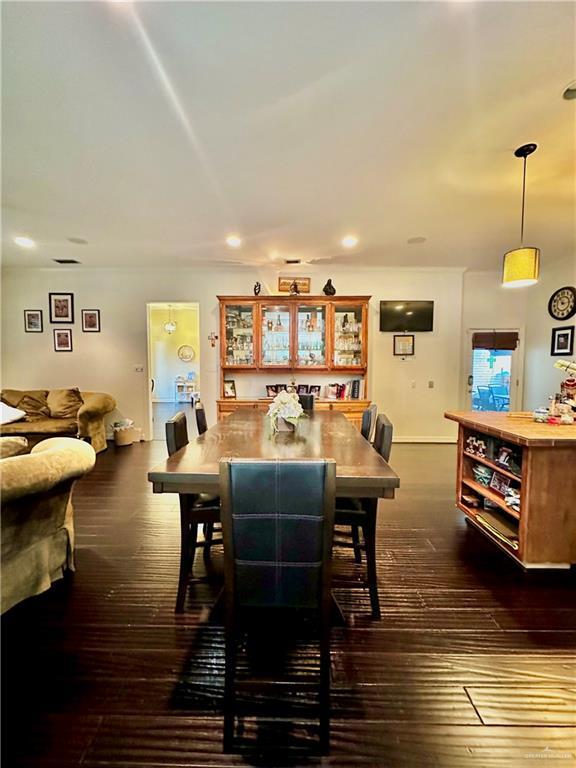 dining area with dark wood finished floors