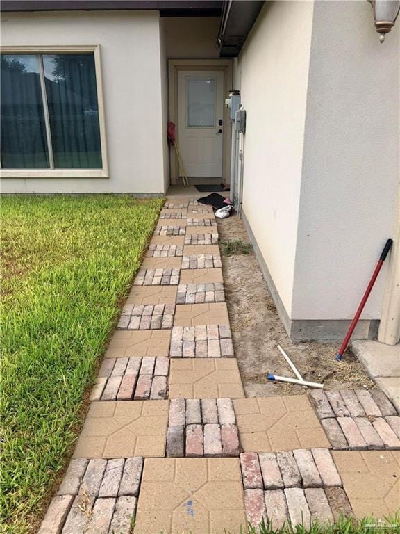 property entrance featuring a yard