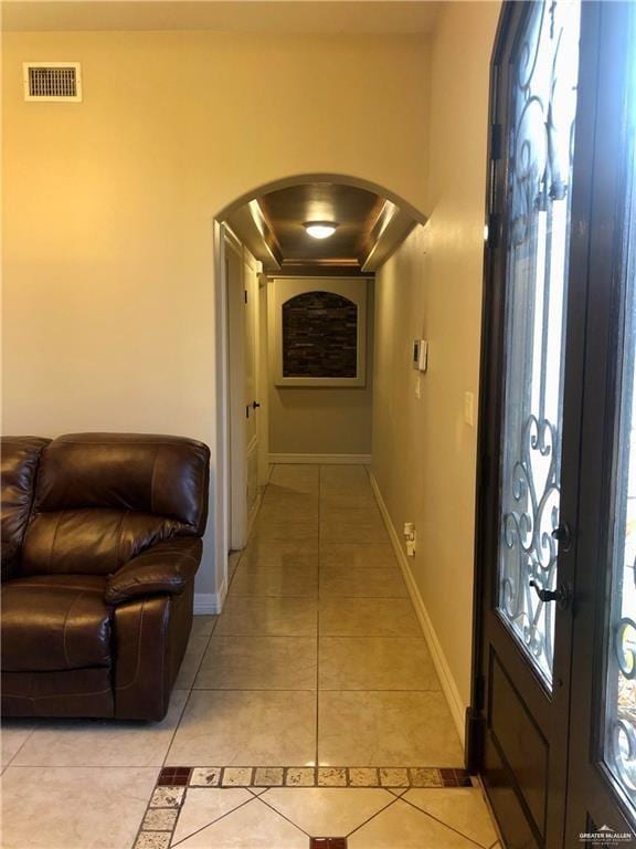 corridor with light tile patterned floors