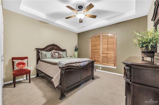 2504 Wernecke Ave, Mission, TX 78574 - bedroom with a tray ceiling, light carpet, baseboards, and ceiling fan