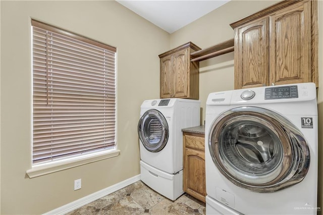 2504 Wernecke Ave, Mission, TX 78574 - laundry room featuring washing machine and clothes dryer, baseboards, and cabinet space
