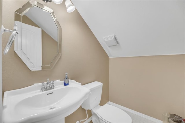 2504 Wernecke Ave, Mission, TX 78574 - half bath featuring a sink, toilet, and vaulted ceiling
