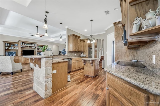2504 Wernecke Ave, Mission, TX 78574 - kitchen with black electric stovetop, dishwasher, tasteful backsplash, ceiling fan, and arched walkways