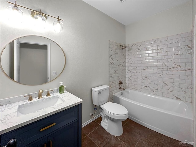 full bathroom with tile patterned floors, vanity, tiled shower / bath combo, and toilet