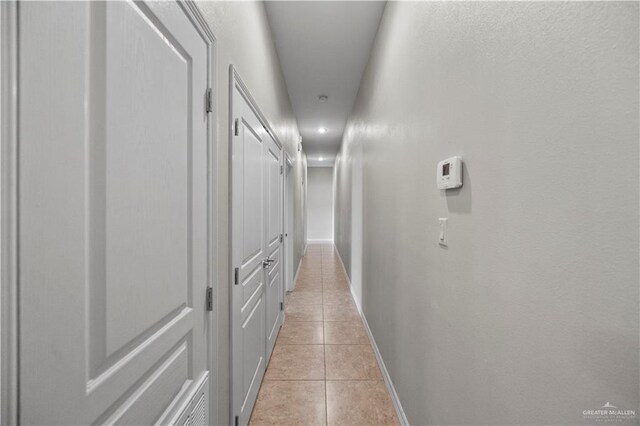 2715 Mimosa St Unit 9, Mission, TX 78572 - hallway with light tile patterned floors, baseboards, and recessed lighting