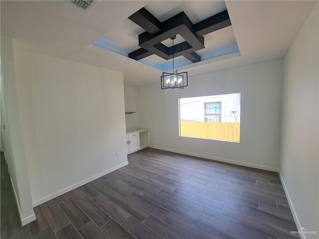 708 E 3rd Ave, Elsa, TX 78543 - unfurnished dining area featuring baseboards, wood tiled floors, a chandelier, and a tray ceiling