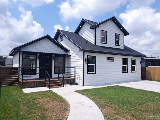 708 E 3rd Ave, Elsa, TX 78543 - view of front of house with a shingled roof and a porch