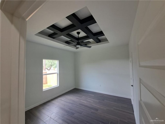 708 E 3rd Ave, Elsa, TX 78543 - spare room with a ceiling fan, coffered ceiling, baseboards, beamed ceiling, and dark wood-style flooring