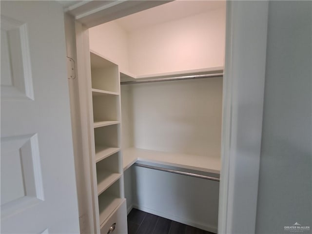 708 E 3rd Ave, Elsa, TX 78543 - walk in closet featuring dark wood finished floors