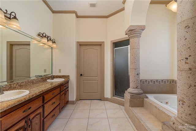 bathroom featuring decorative columns, tile patterned floors, ornamental molding, vanity, and separate shower and tub