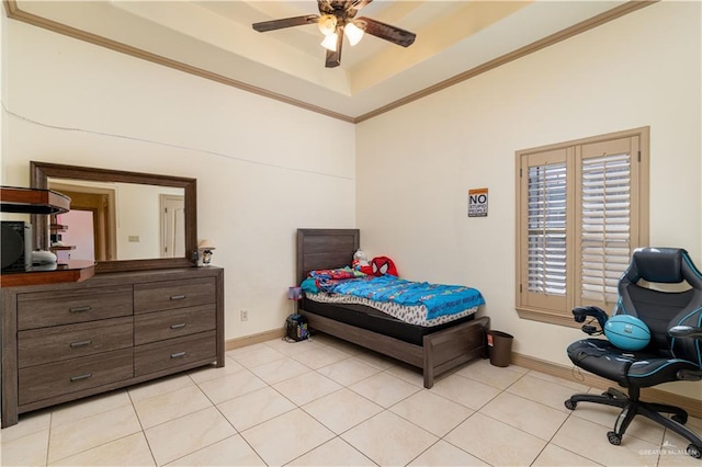 tiled bedroom with ceiling fan, a raised ceiling, and crown molding