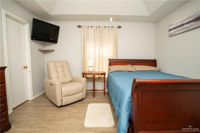 bedroom with hardwood / wood-style floors