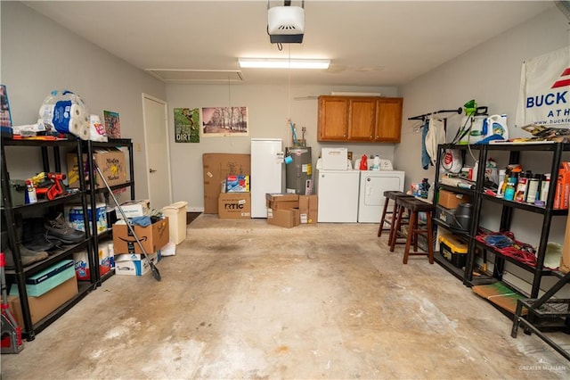 garage with washer and dryer, electric water heater, and a garage door opener